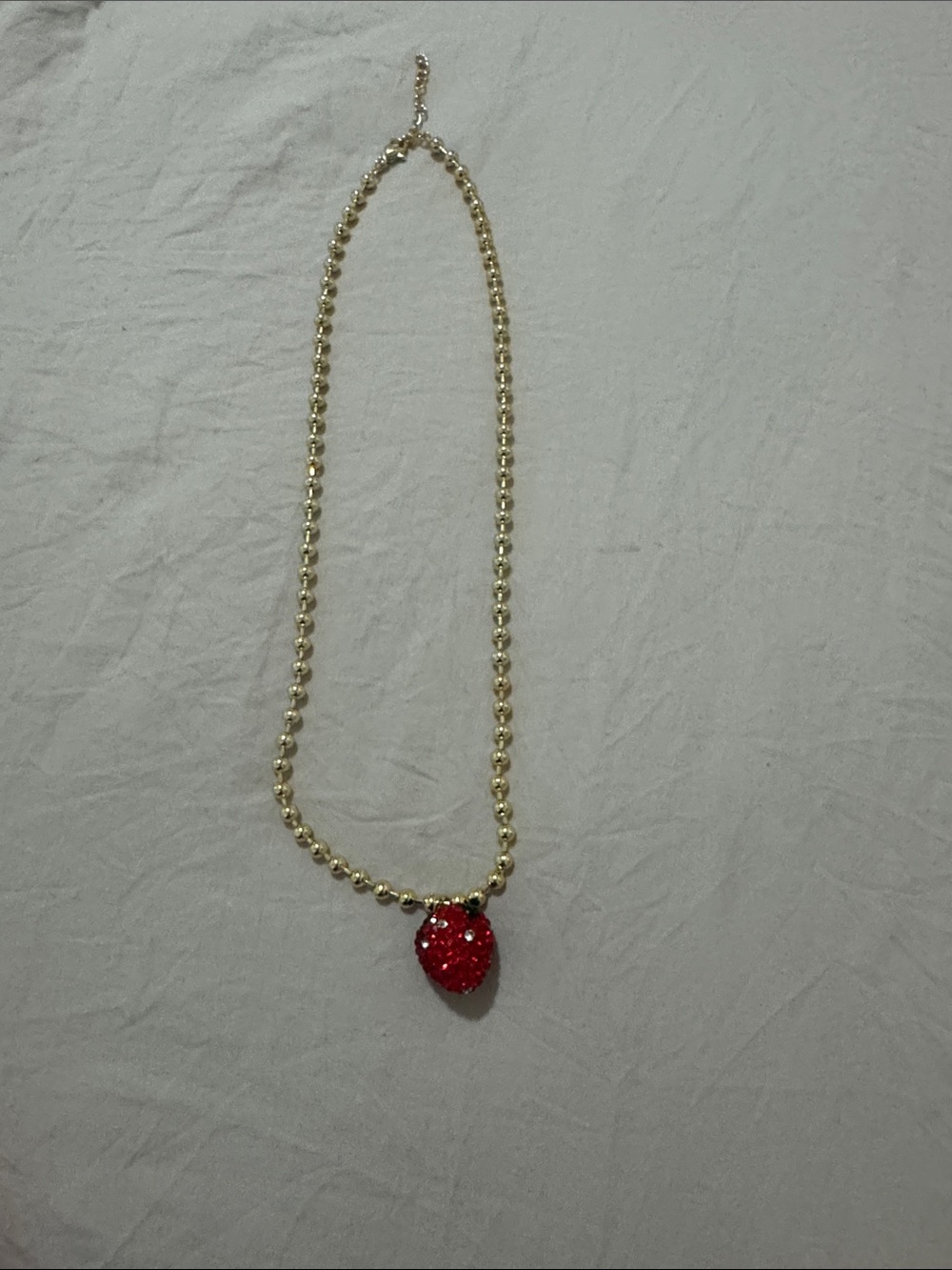 Gold Beaded Necklace with Red Strawberry Pendant